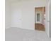 Carpeted bedroom with an open door leading to another room at 5673 Stetson Dr, Whitestown, IN 46052