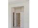 View of the hallway showing neutral walls, white trim, and entryways to adjacent rooms at 5673 Stetson Dr, Whitestown, IN 46052