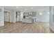 Spacious open kitchen with gray cabinets, stainless steel appliances, an island, and hardwood floors at 5673 Stetson Dr, Whitestown, IN 46052