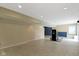 Spacious basement featuring neutral walls, tile flooring, and an exercise machine, providing a versatile area for recreation at 5857 Stone Pine Trl, Carmel, IN 46033