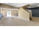 Finished basement with tile flooring, exercise equipment, and sliding glass door at 5857 Stone Pine Trl, Carmel, IN 46033