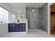 Stylish bathroom featuring double vanity sinks, mosaic shower tiles and glass door at 5857 Stone Pine Trl, Carmel, IN 46033