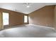 Spacious bedroom offers ample natural light from dual windows and neutral carpeting at 5857 Stone Pine Trl, Carmel, IN 46033