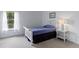 Cozy bedroom featuring single bed, neutral carpet, and ample natural light at 5857 Stone Pine Trl, Carmel, IN 46033