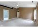 Spacious bedroom with plush carpet, three windows, and two closets at 5857 Stone Pine Trl, Carmel, IN 46033