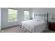 Bright bedroom with ample natural light from two large windows at 5857 Stone Pine Trl, Carmel, IN 46033
