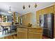 Bright kitchen with a central island, open to a dining area and a cozy living space at 5857 Stone Pine Trl, Carmel, IN 46033