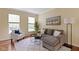 Comfortable living room featuring hardwood floors, natural light and stylish decor at 5857 Stone Pine Trl, Carmel, IN 46033