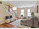 Spacious living room with hardwood floors and staircase at 5857 Stone Pine Trl, Carmel, IN 46033
