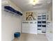 Organized walk-in closet featuring built-in shelving and storage drawers at 5857 Stone Pine Trl, Carmel, IN 46033