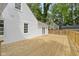 Spacious, newly constructed wooden back deck area with access to the home at 6833 Evanston Ave, Indianapolis, IN 46220