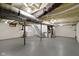 Unfinished basement with visible beams, washer/dryer, and concrete flooring at 6833 Evanston Ave, Indianapolis, IN 46220