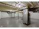 Unfinished basement with painted block walls, concrete floor, exposed ductwork, and utilities at 6833 Evanston Ave, Indianapolis, IN 46220
