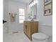 Bright bathroom featuring a modern vanity, marble floors, and stylish decor for a spa-like ambiance at 6833 Evanston Ave, Indianapolis, IN 46220