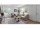 Bright living room with large windows, modern furniture, and stylish decor accents at 6833 Evanston Ave, Indianapolis, IN 46220
