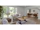 Spacious living room with stylish furnishings, a large window, and an open layout at 6833 Evanston Ave, Indianapolis, IN 46220