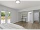 Main bedroom with access to the exterior patio and ensuite at 6833 Evanston Ave, Indianapolis, IN 46220