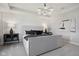 Sizable main bedroom features neutral colors and a modern chandelier at 6842 Jacone Dr, Brownsburg, IN 46112