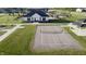 Community pickleball court with a nearby clubhouse and pool, offering recreational opportunities at 6842 Jacone Dr, Brownsburg, IN 46112