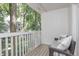 Cozy outdoor balcony with seating and a view of the surrounding trees and neighborhood at 6920 Wesley Ct, Indianapolis, IN 46220