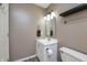Functional half-bathroom featuring a white vanity, modern fixtures, and compact design at 6920 Wesley Ct, Indianapolis, IN 46220