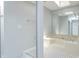 Bright bathroom with a skylight, large mirror, and a soaking tub at 6920 Wesley Ct, Indianapolis, IN 46220
