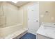 Clean bathroom features a shower with a bathtub, a modern vanity with a marble countertop at 6920 Wesley Ct, Indianapolis, IN 46220