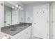 Bathroom featuring a double sink vanity with grey countertop at 6920 Wesley Ct, Indianapolis, IN 46220