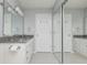 Bathroom featuring a double sink vanity with grey countertop and a mirrored sliding closet at 6920 Wesley Ct, Indianapolis, IN 46220