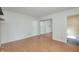 Bedroom features wood flooring, a closet, and an en-suite bath, providing style and convenience at 6920 Wesley Ct, Indianapolis, IN 46220