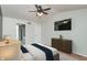 Bedroom with mounted TV, ceiling fan, and ensuite bathroom at 6920 Wesley Ct, Indianapolis, IN 46220