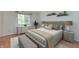 Cozy bedroom with decorative pillows and lamps, side tables, and modern furnishings at 6920 Wesley Ct, Indianapolis, IN 46220