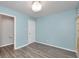 Neutral bedroom boasts fresh paint, stylish flooring, and a closet, providing a calm space at 6920 Wesley Ct, Indianapolis, IN 46220