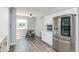 Bright, eat-in kitchen with stainless steel refrigerator, white cabinets, and breakfast nook at 6920 Wesley Ct, Indianapolis, IN 46220