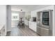 Bright, eat-in kitchen with stainless steel refrigerator, white cabinets, and breakfast nook at 6920 Wesley Ct, Indianapolis, IN 46220