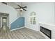 Living room with a fireplace, vaulted ceilings, and a bright, open layout at 6920 Wesley Ct, Indianapolis, IN 46220