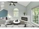 Spacious living room showcasing a fireplace and large windows offering natural light at 6920 Wesley Ct, Indianapolis, IN 46220