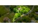 Aerial view of property with mature trees and clearly marked boundaries at 7533 Deerfield Dr, Greenfield, IN 46140