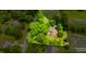 Aerial view of wooded property highlighting mature trees and landscaping at 7533 Deerfield Dr, Greenfield, IN 46140