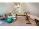 Spacious attic with exercise equipment and storage containers at 7533 Deerfield Dr, Greenfield, IN 46140