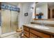 Bathroom featuring tiled floors, modern vanity, glass enclosed shower, and modern lighting at 7533 Deerfield Dr, Greenfield, IN 46140