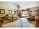 Bright and airy bedroom with hardwood furniture, carpet floors, and natural light through the window at 7533 Deerfield Dr, Greenfield, IN 46140