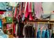Walk-in closet with clothes and storage boxes at 7533 Deerfield Dr, Greenfield, IN 46140