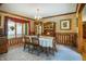 Elegant dining room featuring a classic hutch, chandelier lighting, and a bright window at 7533 Deerfield Dr, Greenfield, IN 46140