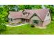 Charming home featuring a brick facade, manicured lawn, and inviting front porch at 7533 Deerfield Dr, Greenfield, IN 46140