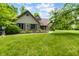 Beautiful home with brick accents, complemented by green shutters and a well-maintained lawn at 7533 Deerfield Dr, Greenfield, IN 46140