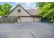Spacious three-car garage with ample parking space and a private entrance at 7533 Deerfield Dr, Greenfield, IN 46140