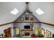 Vaulted living room with skylights and a brick fireplace at 7533 Deerfield Dr, Greenfield, IN 46140
