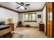 Bright office with natural light and a bookcase-themed wallpaper border at 7533 Deerfield Dr, Greenfield, IN 46140