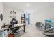 Spacious bedroom featuring an ergonomic gaming chair, a desk, and a comfortable lounge area with a side table at 7834 Hillway Dr, Camby, IN 46113